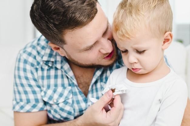 Young man talking to an angry child Free Photo